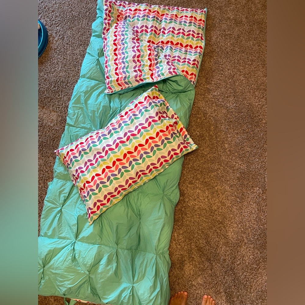 Pottery barn teen sleeping bag with matching pillow case.